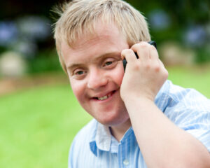 NDIS participant on the phone with support coordinator using etrack software